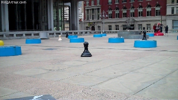 Daniel Brouse writing a Christmas song surrounded by giant game pieces